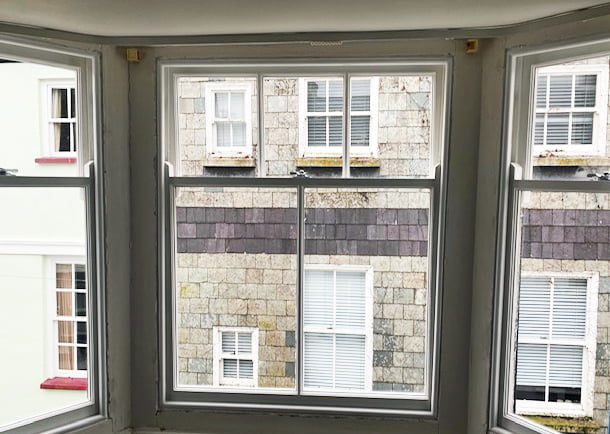 Interior view of replacement timber sliding sashes in a Grade II listed townhouse, Dartmouth, Devon
